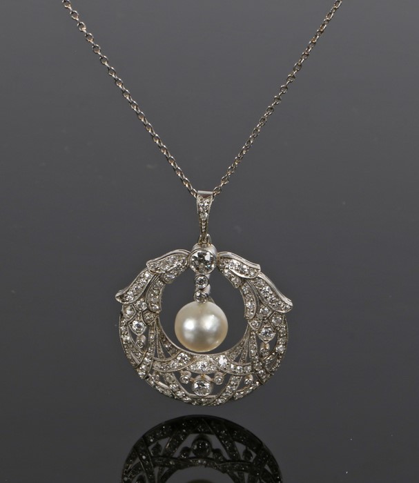 Diamond and pearl necklace, with a central pearl and a lappet diamond surround, an estimated total