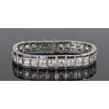 Fine Art Deco diamond and sapphire platinum bracelet, the graduated bracelet with a central row of