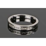 Platinum and diamond set half eternity ring, with a row of diamonds to a total of 0.20 carats, rings