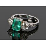Columbian emerald and diamond set ring. The central certificated 1.55 carat natural emerald