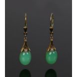 Chinese 8 carat gold and jade set earrings, with cabochon cut drops, the jade 8mm diameter