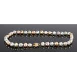 Pearl necklace, with a row of Chinese freshwater pearls and grey Tahitian South Sea pearls