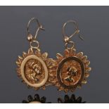 Pair of yellow metal earrings, with a profile bust to the oval frames with star burst fret