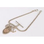 Silver pocket watch chain, with a clip to each end, a T bar , medallion, an anchor pendant and a