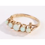 9 carat gold opal set ring, with five opals to the head, ring size R