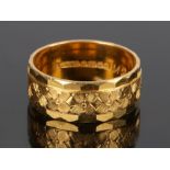 22 carat gold wedding band, with flower head design, 8.9 grams, ring size R