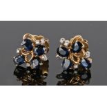 Pair of 14 carat gold sapphire and diamond set earrings, in the form of flowers and petals, 13mm