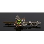 Peridot and diamond set insect brooch, with a peridot back at 1 carat and diamond wings and a