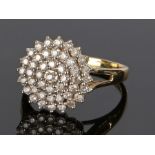 18 carat gold diamond set cluster ring, with a wide circular cluster head, ring size U