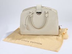 Louis Vuitton Pairs leather handbag, cream leather with zip and clasp opening, the base of the bag