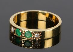 18 carat gold, emerald and diamond set ring, with two emeralds and two diamonds to the shank, ring