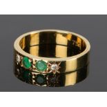 18 carat gold, emerald and diamond set ring, with two emeralds and two diamonds to the shank, ring