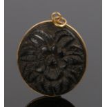 19th Century Chinese gold and carved wood pendant, the oval pendant carved with a flower and