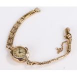 9 carat gold ladies wristwatch, the dial with Arabic numerals, manual wound, the case 15.5mm wide,