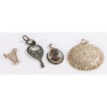 Silver pendants and charms, to include round filigree pendant, harp, cameo style pendant,