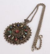 Middle Eastern white metal medallion and chain, the medallion with multi-coloured pearl cut beads to