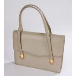 Gucci ladies handbag, the grey leather exterior with gilt mounts, stamped "Made in Italy by Gucci"