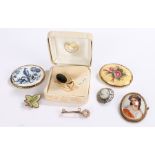 Seven brooches, to include Aysnley floral porcelain brooch, Wedgwood style cameo brooch etc. (7)