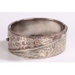 Silver bangle, with gilt foliate and scroll decoration, 30g