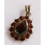 8 carat gold and garnet set pendant, stamped 333 to the hanging loop, 1.5g