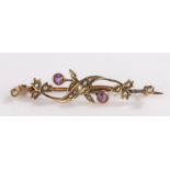 9 carat gold brooch set with two amethysts and seed pearls, 2.4g