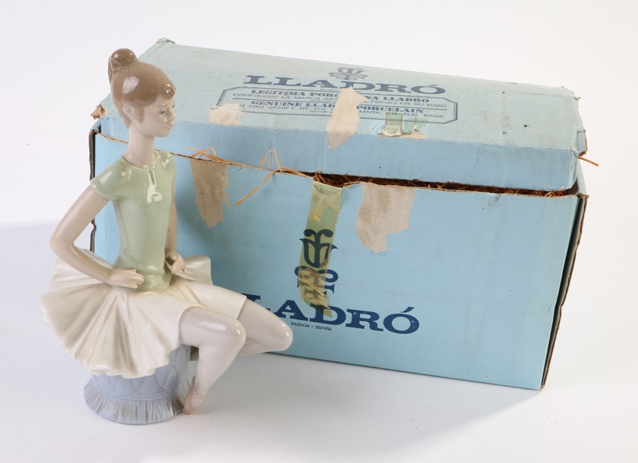 Lladro porcelain figure, ballerina seated on a footstool, 22.5cm high, with box