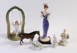 Porcelain figures to include Beswick horse, bisque figure of a young boy on a later swing, figure of