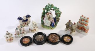 Staffordshire porcelain to include figure depicting a couple beneath an arbour, six cottages and
