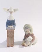 Two Lladro porcelain figures, nun kneeling in prayer, 22cm high, inuit child with polar bear, 12cm