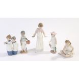 Five Nao porcelain figures, girl with chamber stick, 25cm high, seated ballerina, 14cm high, girl