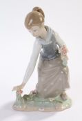 Lladro figure, young girl picking flowers, 21cm high