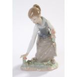 Lladro figure, young girl picking flowers, 21cm high