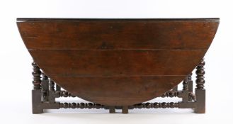 Very Large Charles II oak double gateleg table, English circa 1660 – 1670. the oval plank top