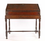 William and Mary / Queen Anne oak desk on stand, English, circa 1690 – 1710. the fall front sloped