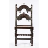 Charles II Oak Derbyshire chair, circa 1660 – 1680. with twin arcaded back panel carved with reverse