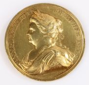 Queen Anne medal, circa 1713, struck in yellow metal, commemorating the Peace of Utrecht, 1713.