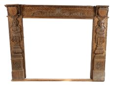 Mid to late 19th Century oak Elizabethan style fireplace, English, circa 1850 – 1880. the fire