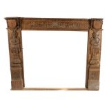 Mid to late 19th Century oak Elizabethan style fireplace, English, circa 1850 – 1880. the fire