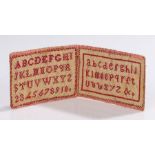 Rare 19th Century sampler needle case, in the form of a book, the silk exterior enclosing