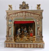 Late 19th Century toy theatre, with a backdrop and curtained front, figures attached to metal rods