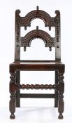 Charles II Oak Derbyshire chair, circa 1660 – 1680. with twin arcaded back panel carved with reverse