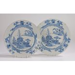 Pair of 18th Century English Delft plates, with a pagoda and trees set among water, the rim of the