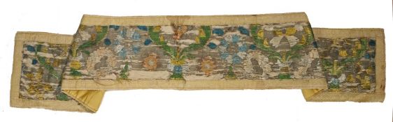 17th Century silk runner, with a flower head and stem design in blues, greens and yellows, 173cm
