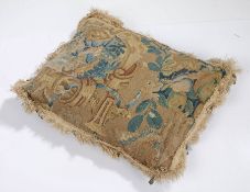 17th Century tapestry cushion, with a scroll and flowers surrounding fruit, 40cm diameter