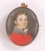 George III miniature portrait, of an officer in a red military tunic, the reverse with initials