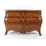 19th Century French tulipwood commode, the serpentine marble top above the bombe base with three