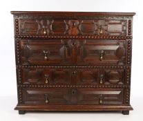Charles II oak chest of drawers, English circa 1680. with plank top above graduated sets of