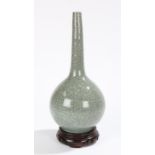 Chinese crackle glaze celadon bottle vase, on a hard wood stand, 27cm high excluding the stand