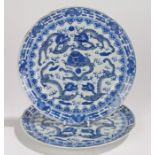 Pair of Chinese porcelain plates, Kangxi, decorated with dragons to the centre and bats to the edge,