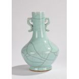 Chinese celadon glaze porcelain vase, the long neck with arched handles and squat body on a circular